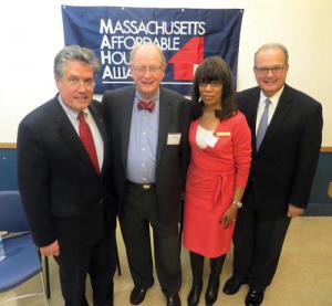 US Comptroller of the Currency Thomas Curry, left, with former Sovereign Bank vice president Thomas Kennedy, Bonita M. Irving, district community affairs officer for the Comptroller of the Currency, and Andrew Calamare, a former state banking commissioner